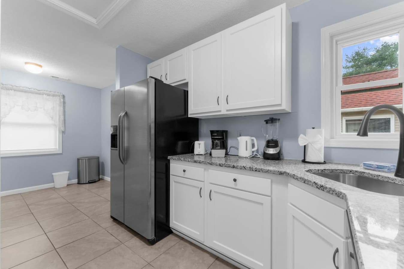 Spacious kitchen with full-size appliances and countertop appliances.