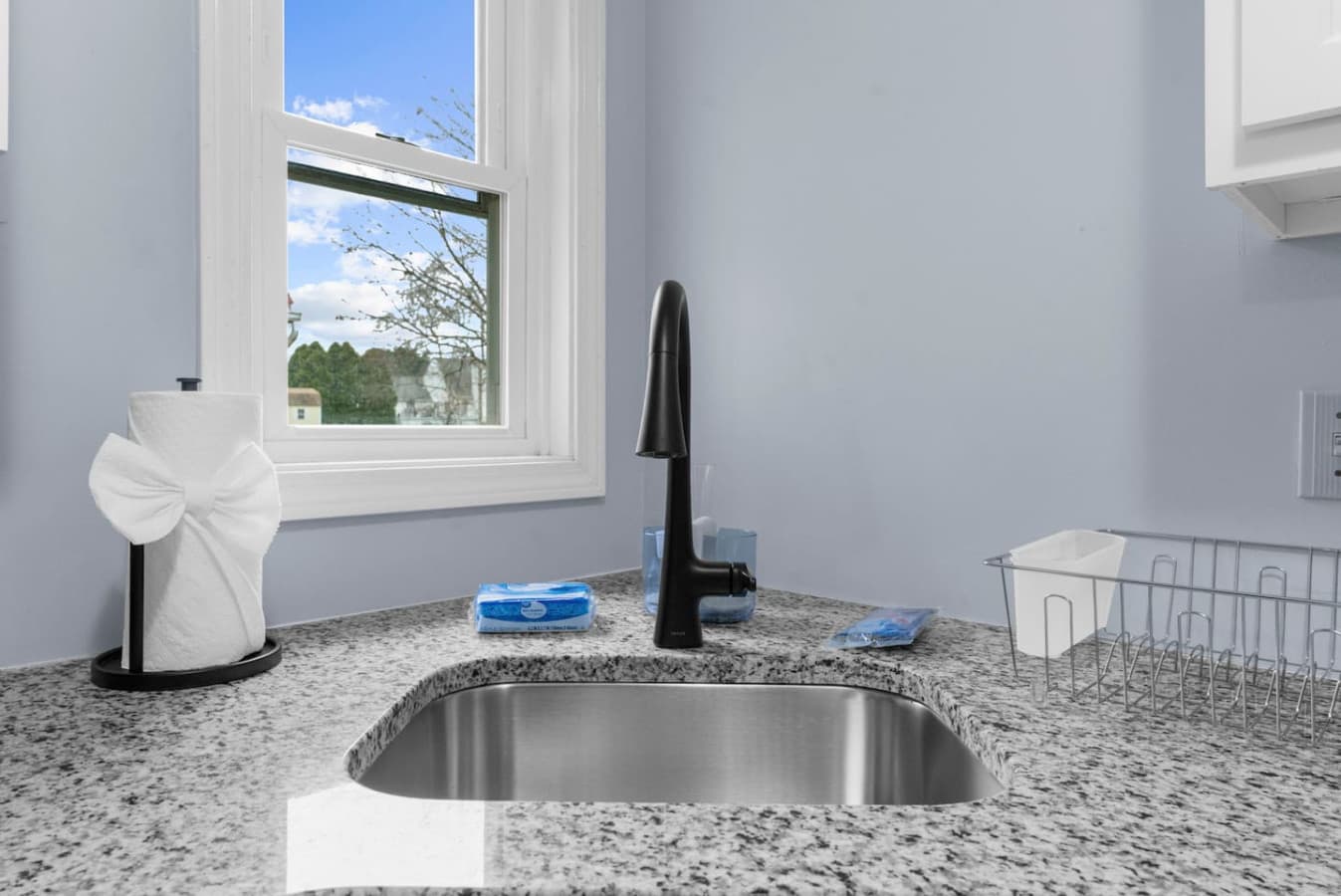 Window view from the sink offering plenty of daylight.