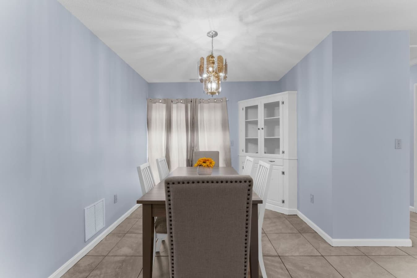 Dining room with comfortable seating and soft natural light.