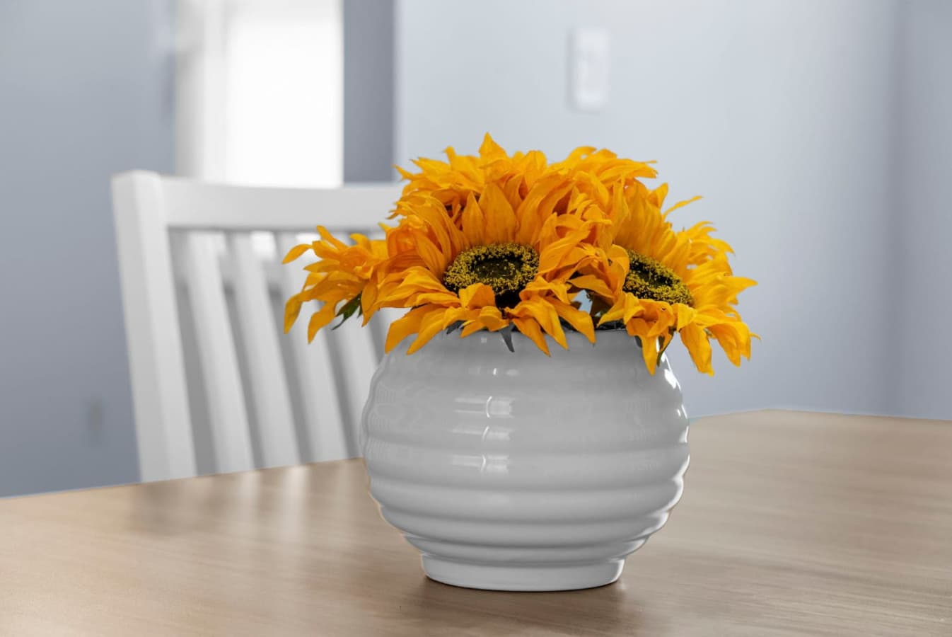 Simple centerpiece adding a warm touch to the table.
