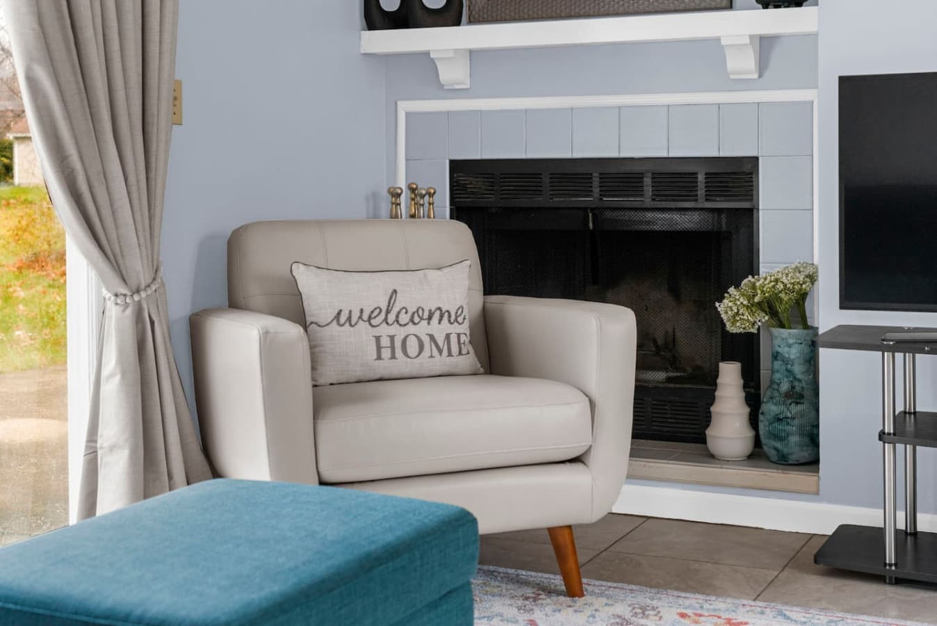 Armchair by the fireplace creating a warm spot to unwind.