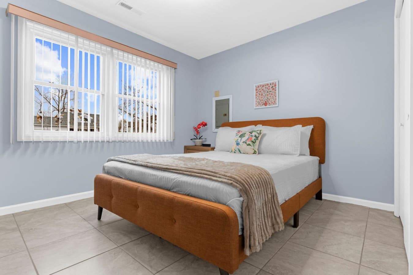 Spacious bedroom with a warm and inviting feel.