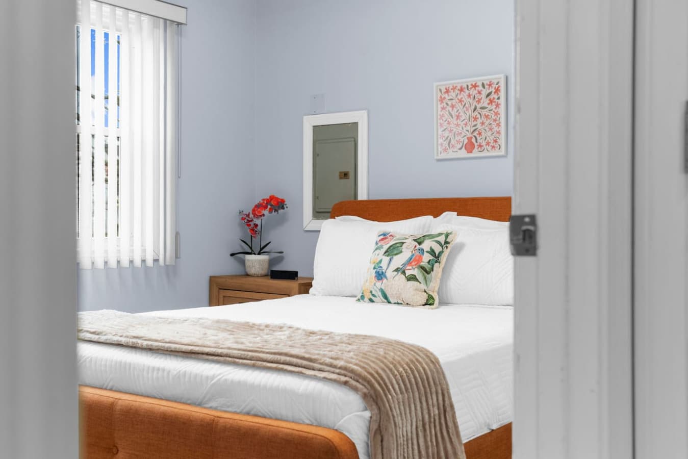 Cozy bedside setup with natural light and simple accents.