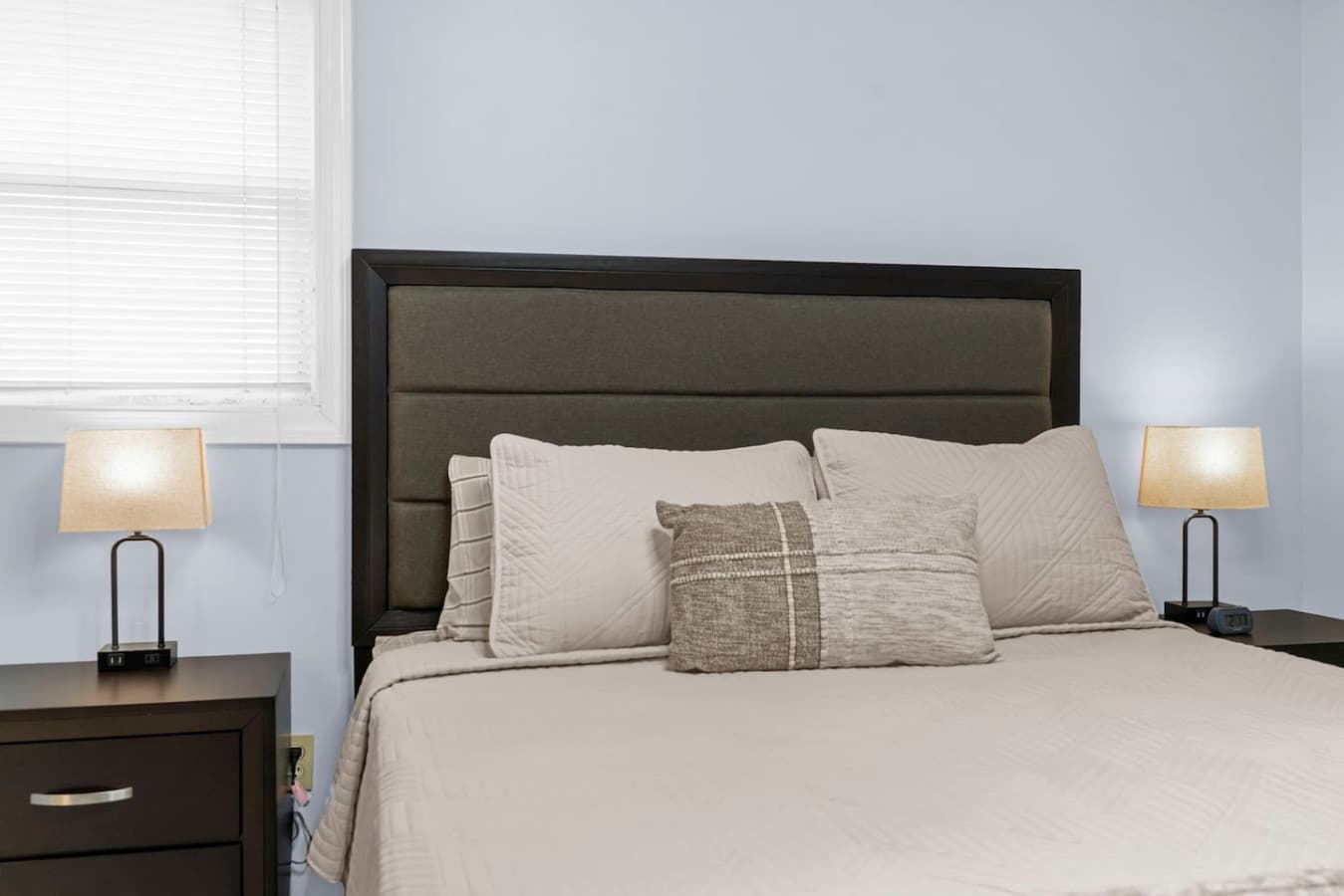Close view of the bedding and pillows for a cozy touch.