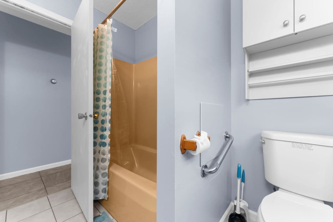 Shower and tub combination with a curtain for privacy.