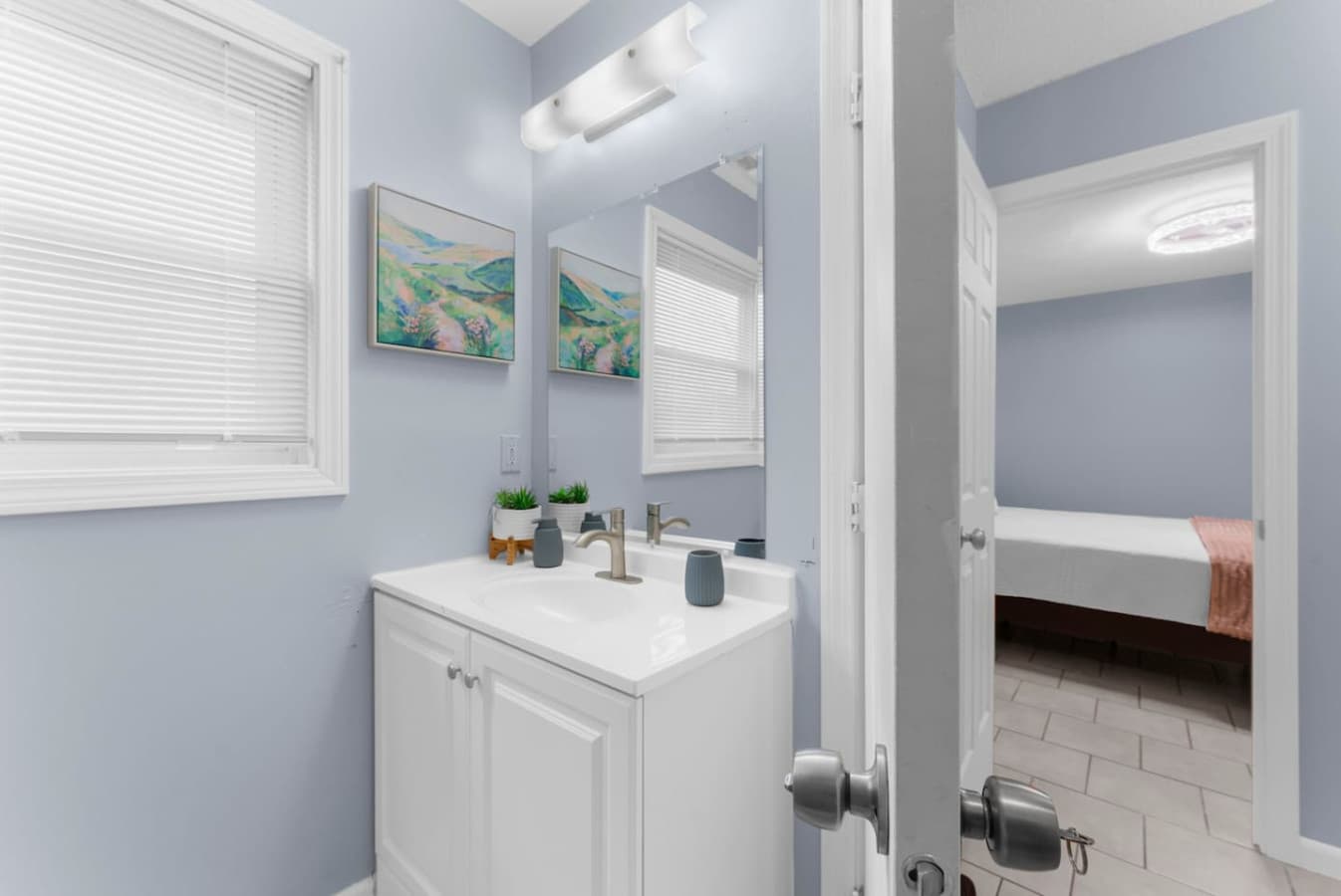 Full bathroom with a well-lit vanity and essential toiletries.