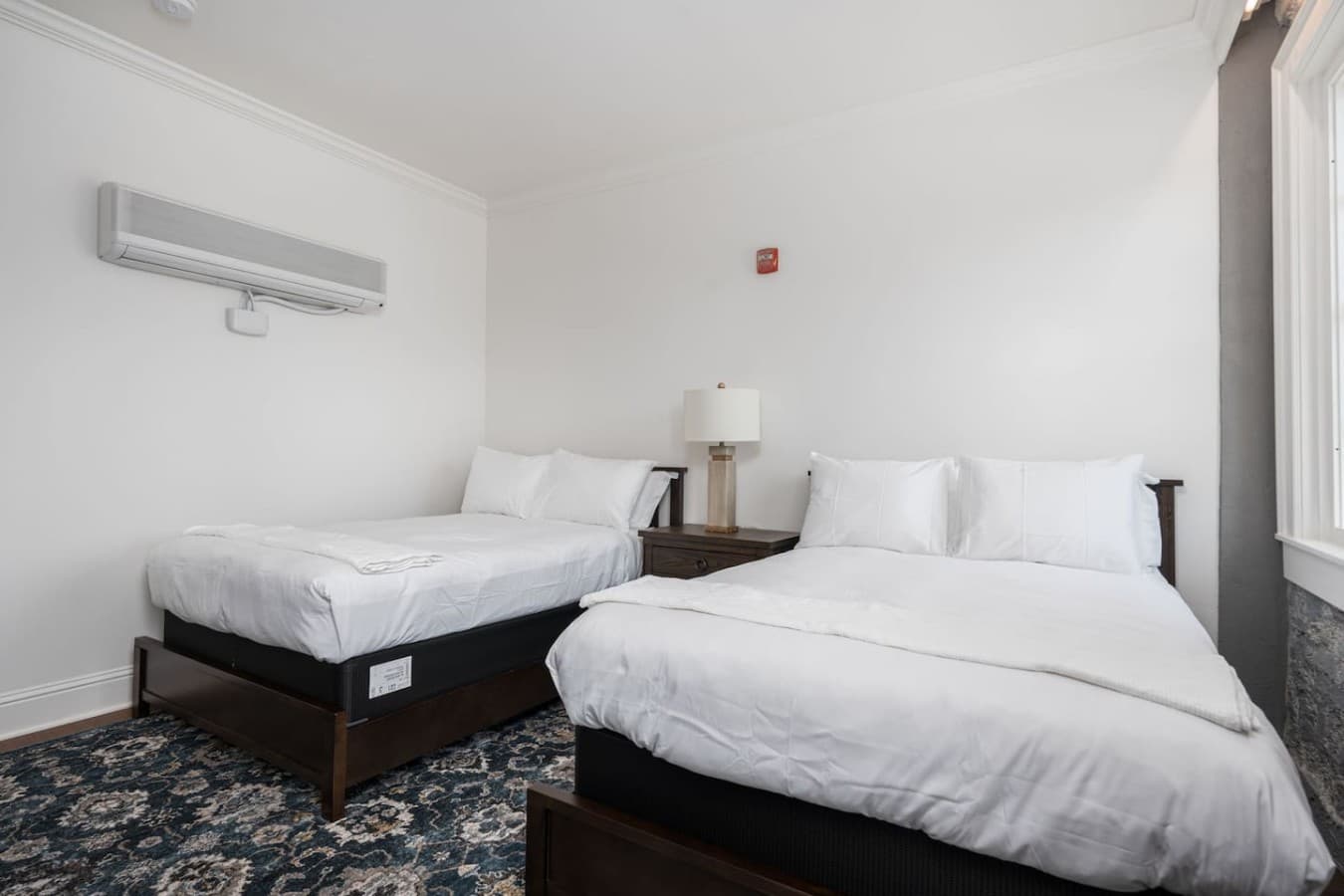 This is the private room you will be renting offering two double beds and a spacious layout for a relaxed stay.