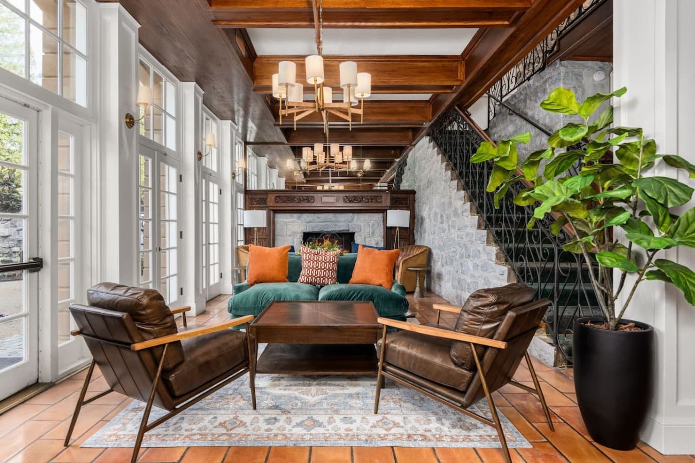 A beautifully furnished shared lounge with elegant lighting and vibrant seating located in the hotel’s common space and not inside your private room.