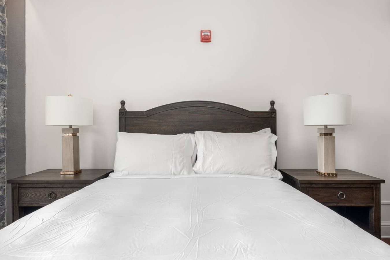 This is the private room you will be renting showcasing a comfortable bed with a calm, minimalist design.