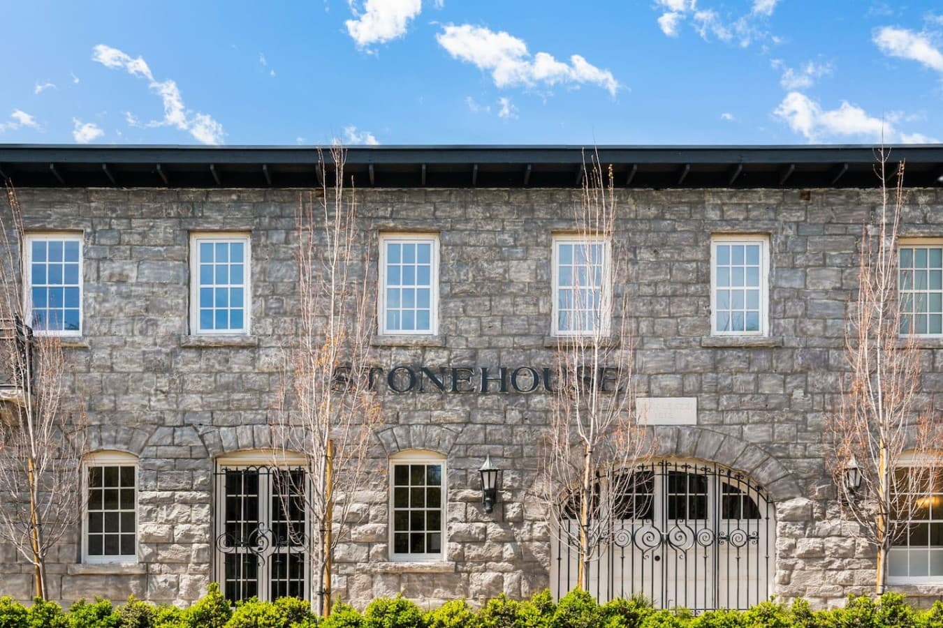 A close look at the hotel’s stone facade and entry details capturing its unique historic charm.