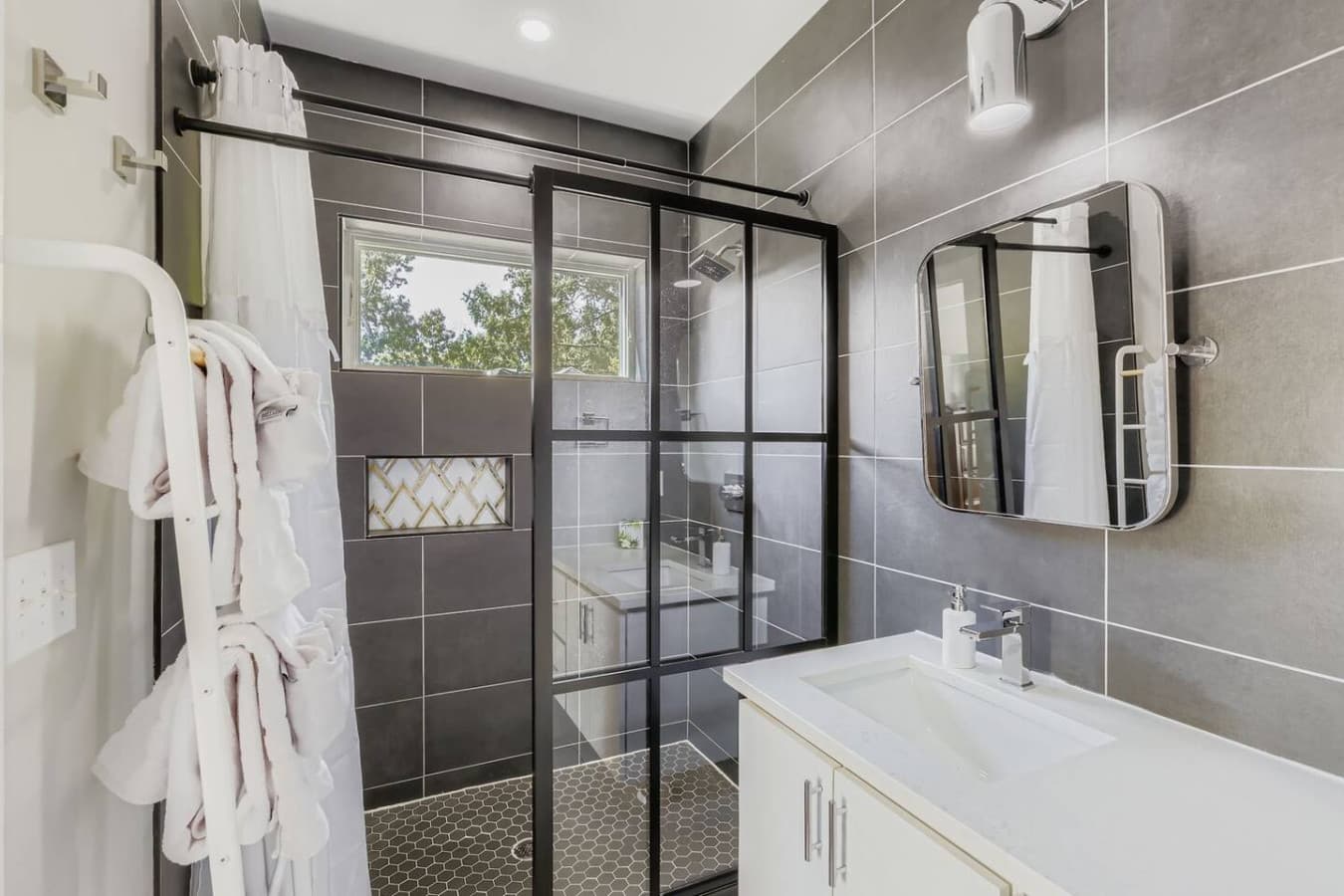 Unit A: Full bathroom with spacious walk-in shower.
