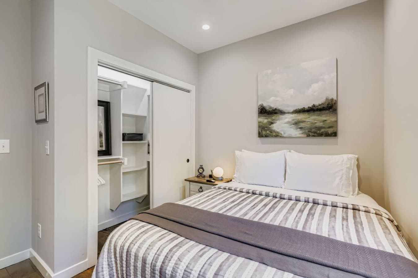 Unit A: Comfortable second bedroom with a queen bed.