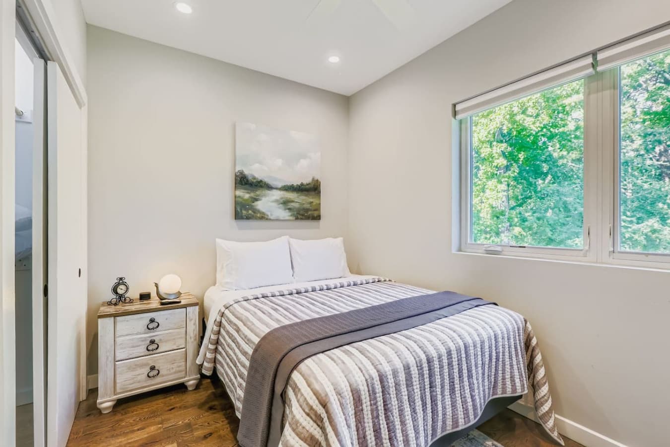 Unit A: Queen bed in the second bedroom.