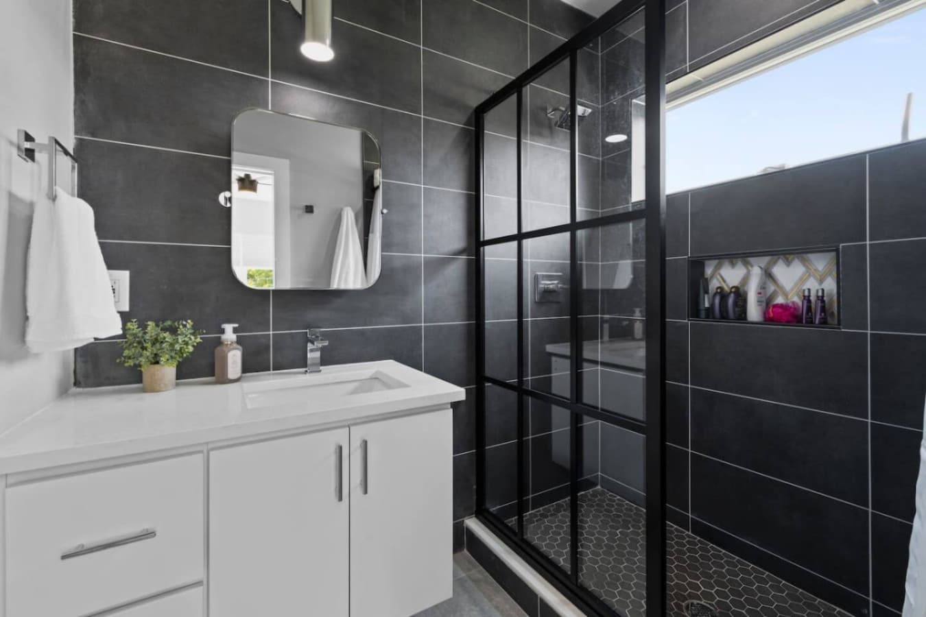 Unit B: Full bathroom with spacious walk-in shower.