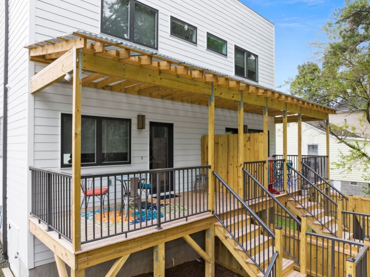 Unit B: Covered back porch with private stair access, perfect for enjoying the outdoors.