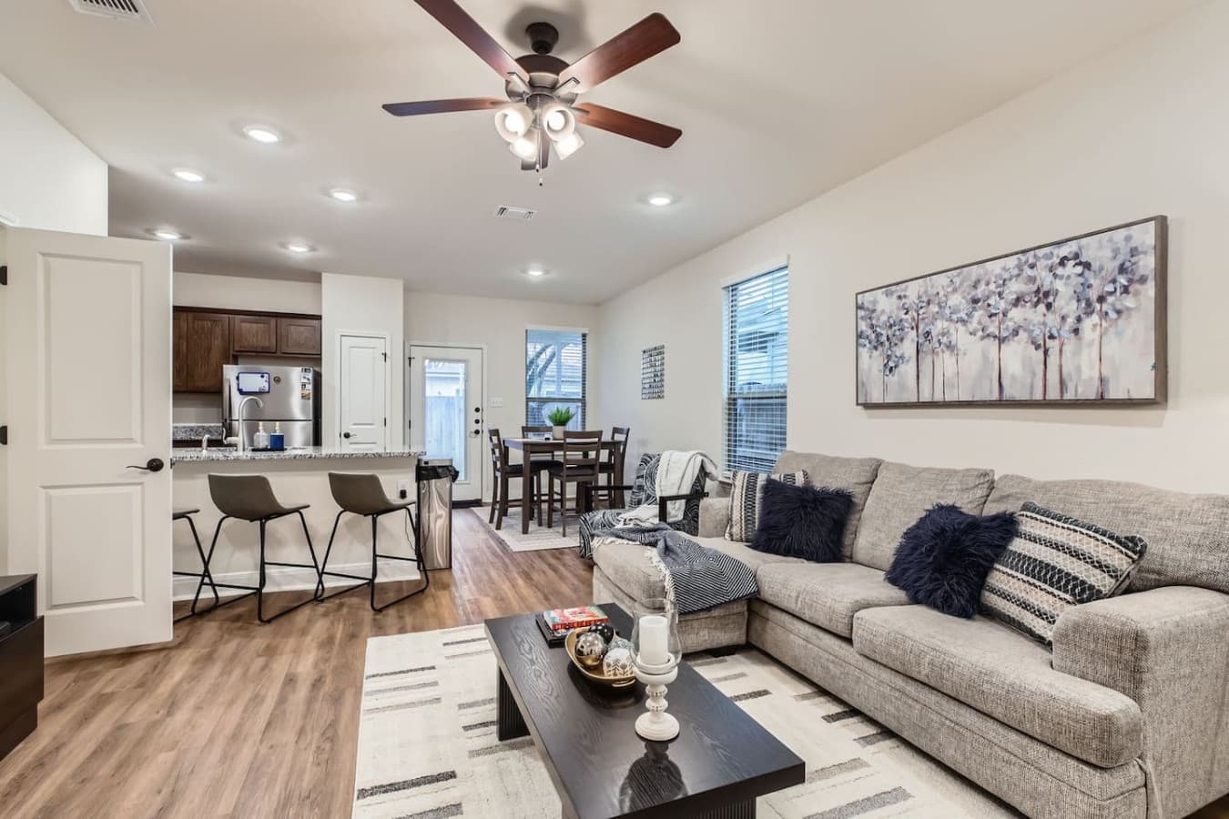 Open concept spacious living room and kitchen area.