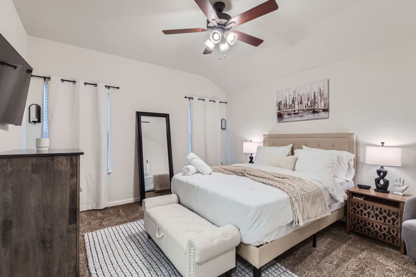 Upstairs, the master bedroom awaits, a tranquil retreat featuring a queen bed for a restful night's sleep.