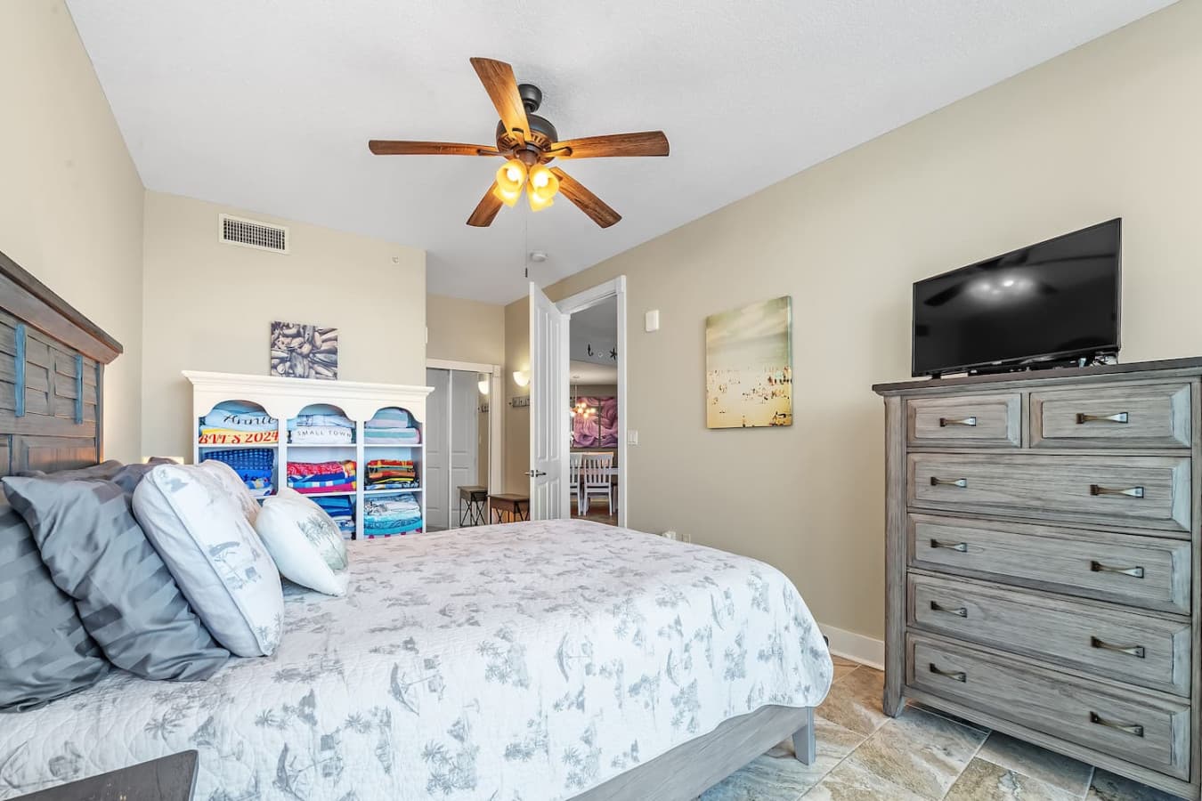 Unwind in the second bedroom with a queen-size bed and TV.