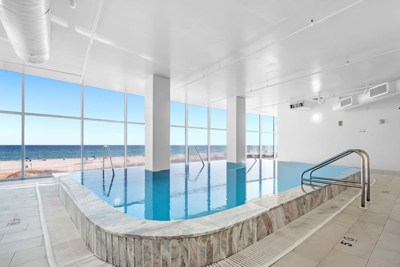 Indoor pool with beach views.
