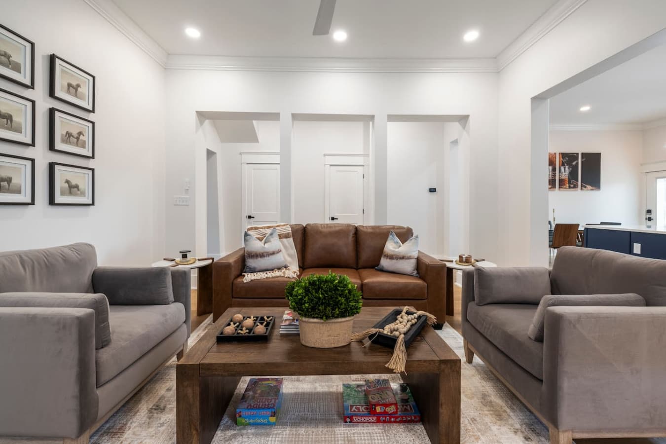 Living room with a queen sofa sleeper ready for guests.