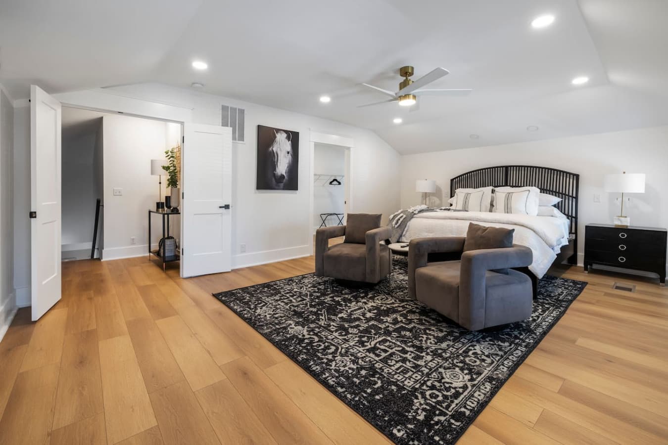 Spacious master bedroom featuring a king size bed.
