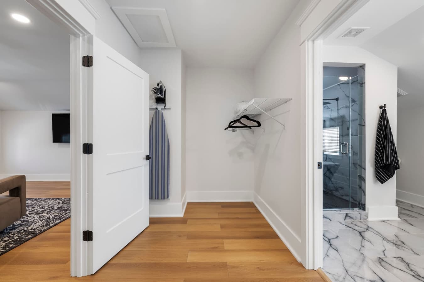 Spacious closet that meets the bathroom in the master bedroom.