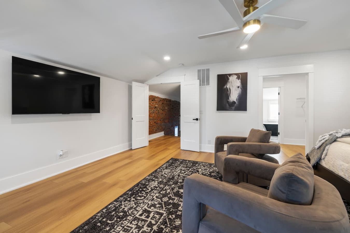 Large TV in the master bedroom.