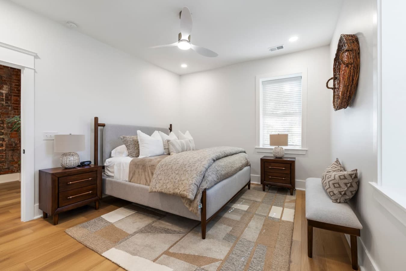 Second bedroom featuring a cozy king size bed.