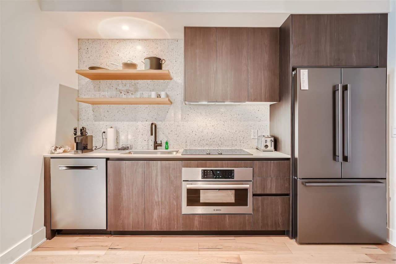 Kitchen features a Nespresso coffee maker.