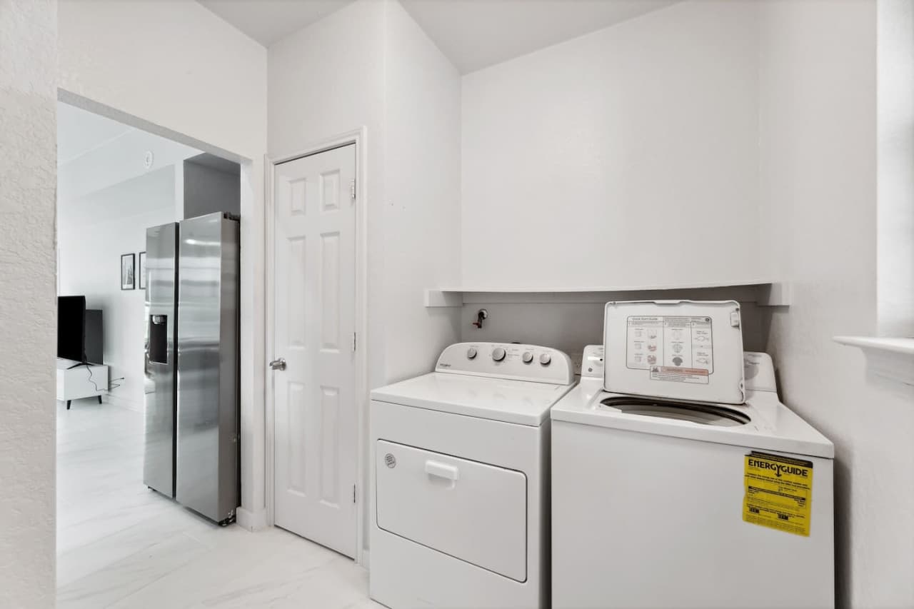 Laundry room featuring a washer and dryer for your use during your stay. Located off the kitchen space.