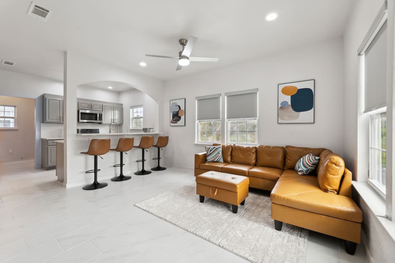 Open open-concept kitchen and living room space blend seamlessly to create a spacious and cozy vibe.