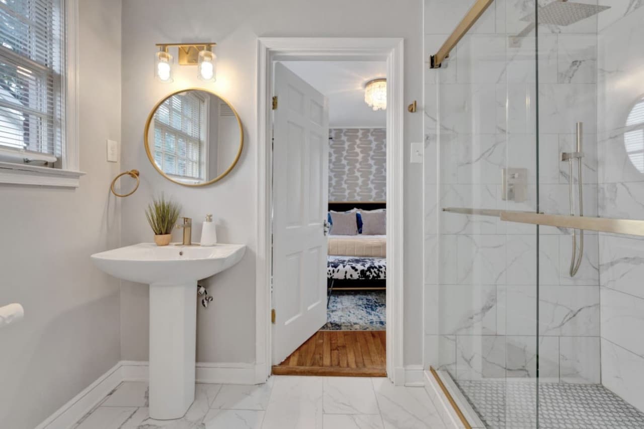 En-suite bathroom featuring a step in shower in the second bedroom.