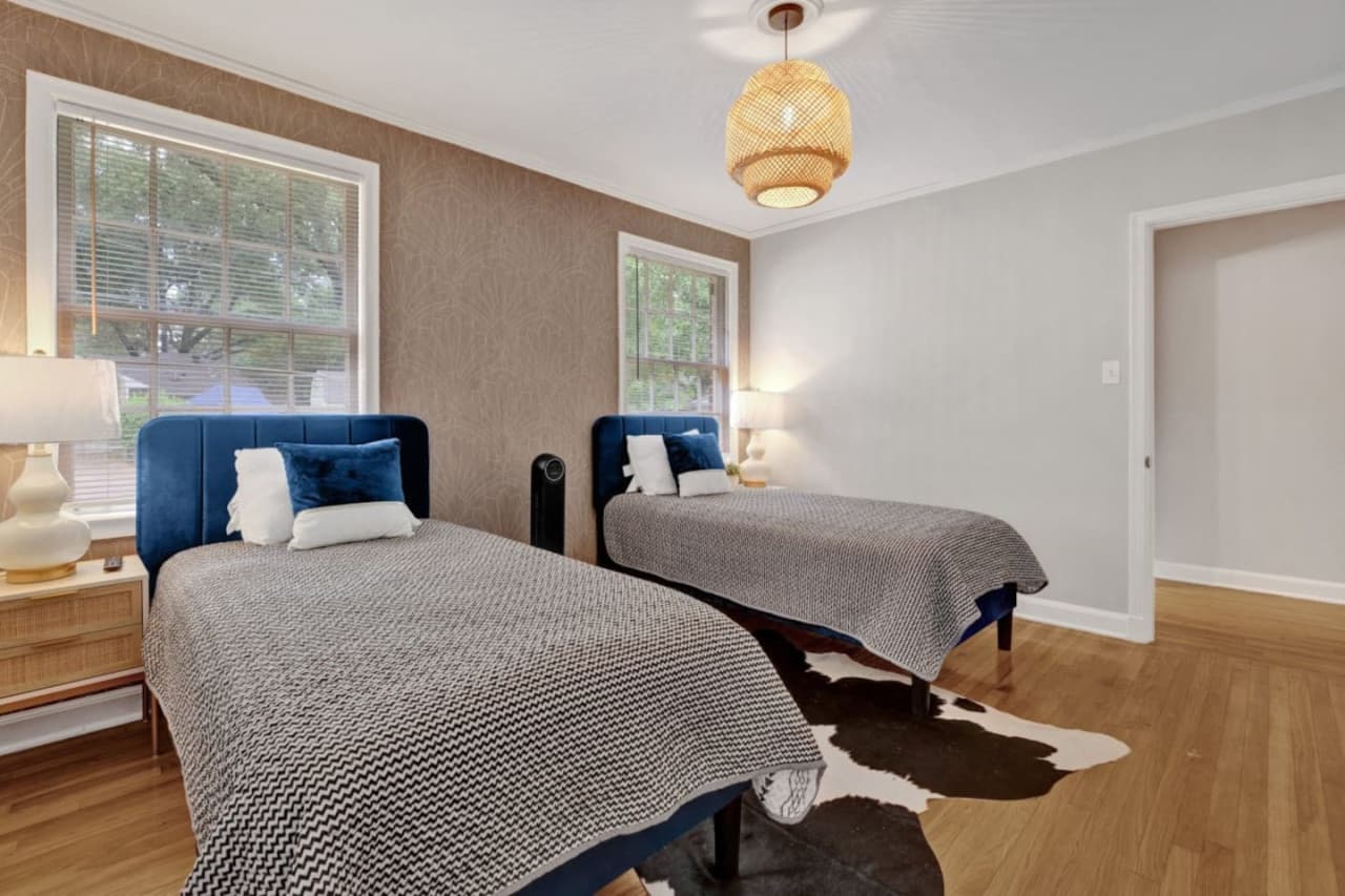 The third bedroom features two full beds.