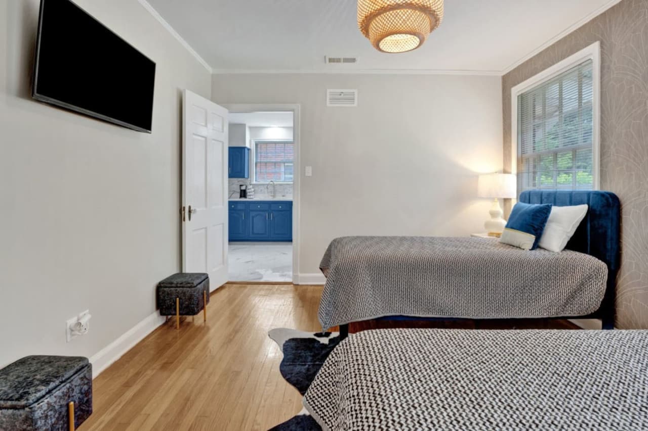 Off the kitchen, is the third bedroom featuring two full size beds and a Smart TV for streaming.