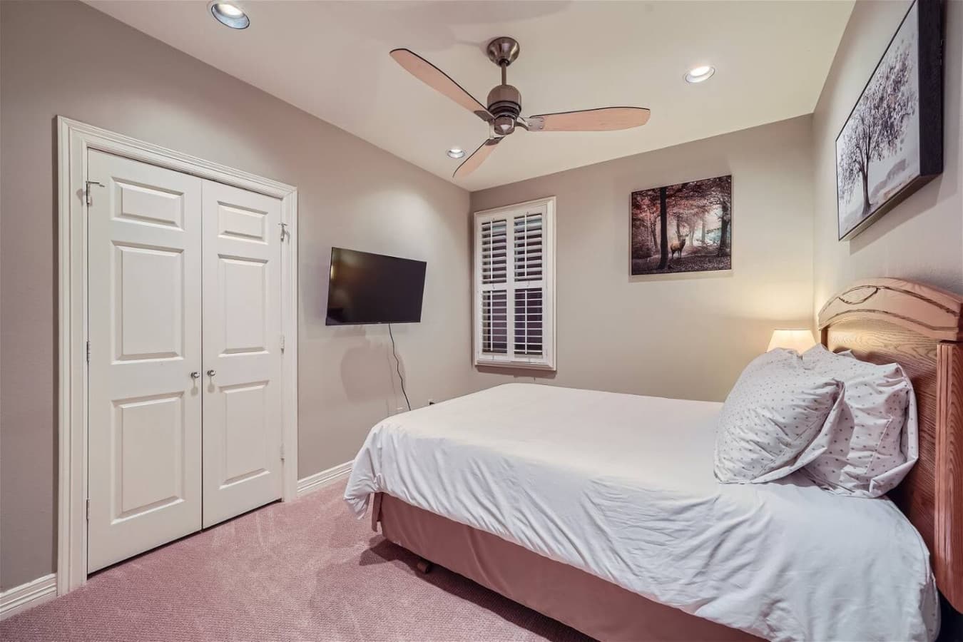 Second bedroom featuring a queen size bed and Smart TV for streaming.
