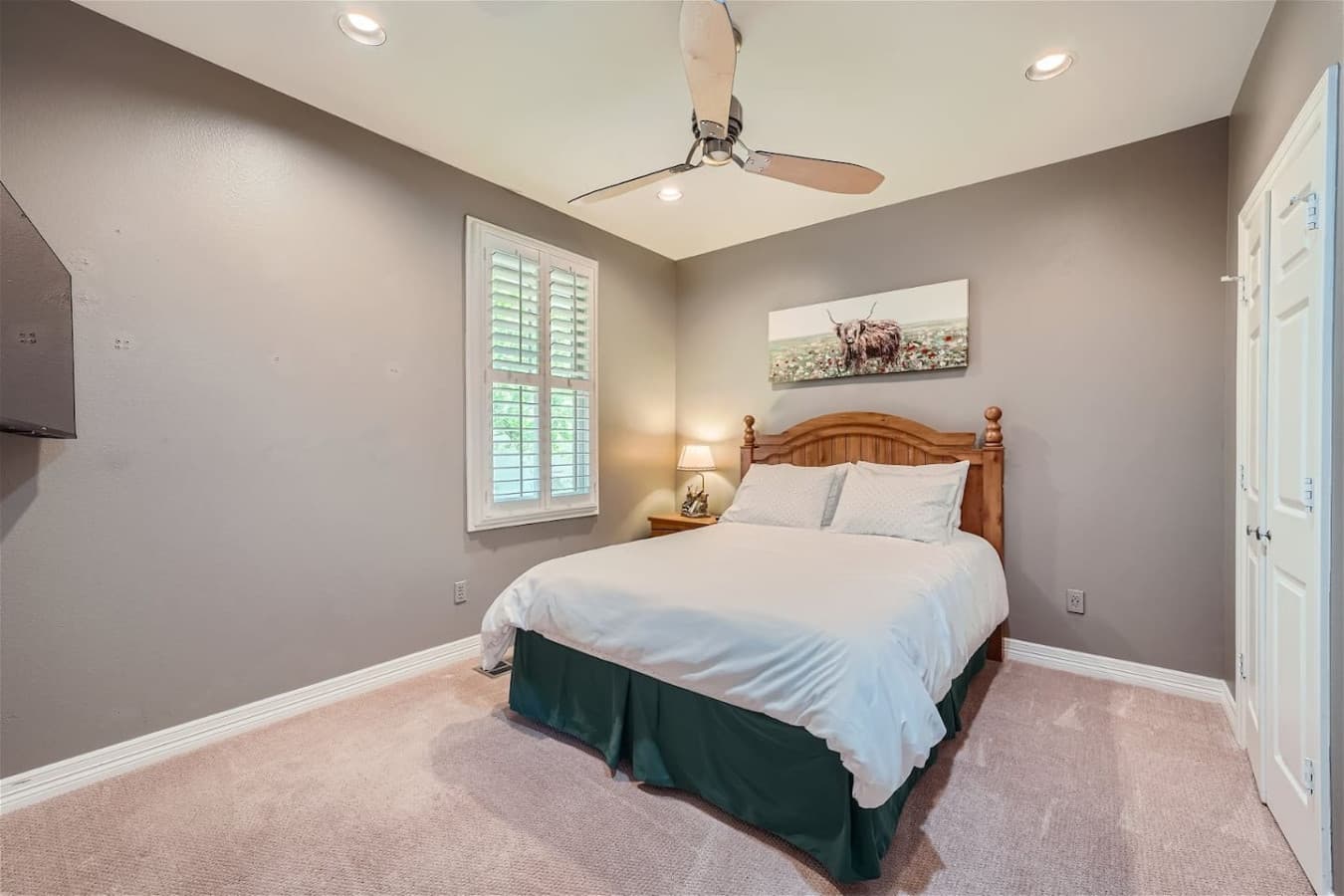 Third bedroom featuring a queen size bed.