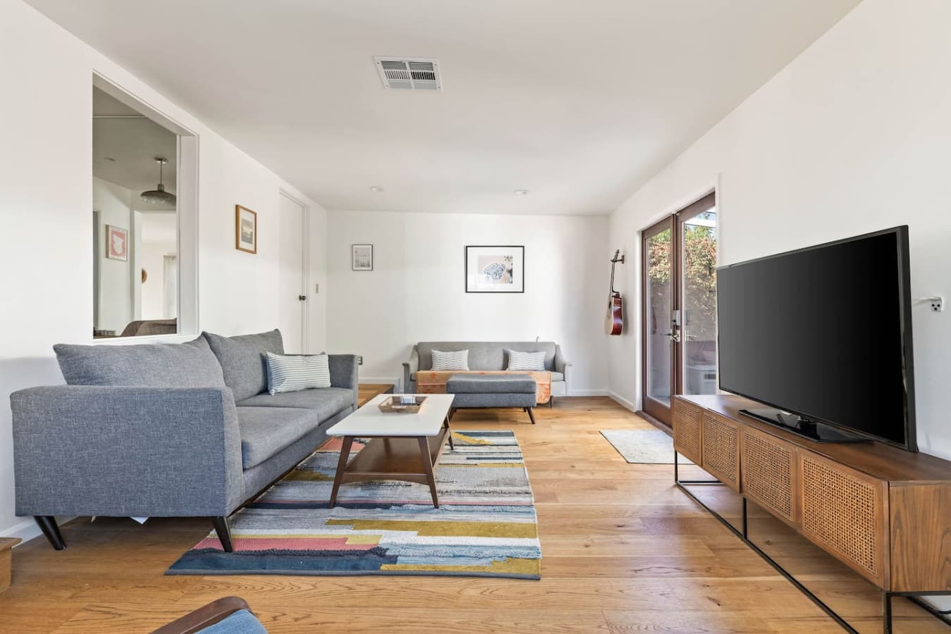 Inviting living room with comfortable seating, natural light, and a cozy space to unwind.