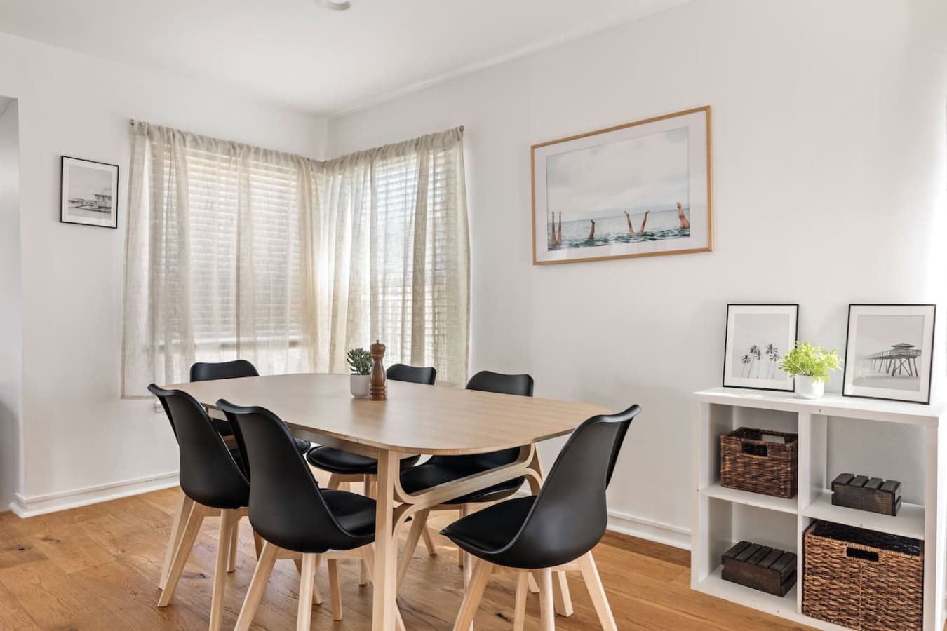 Sun filled dining area with comfortable seating and a relaxed modern feel.