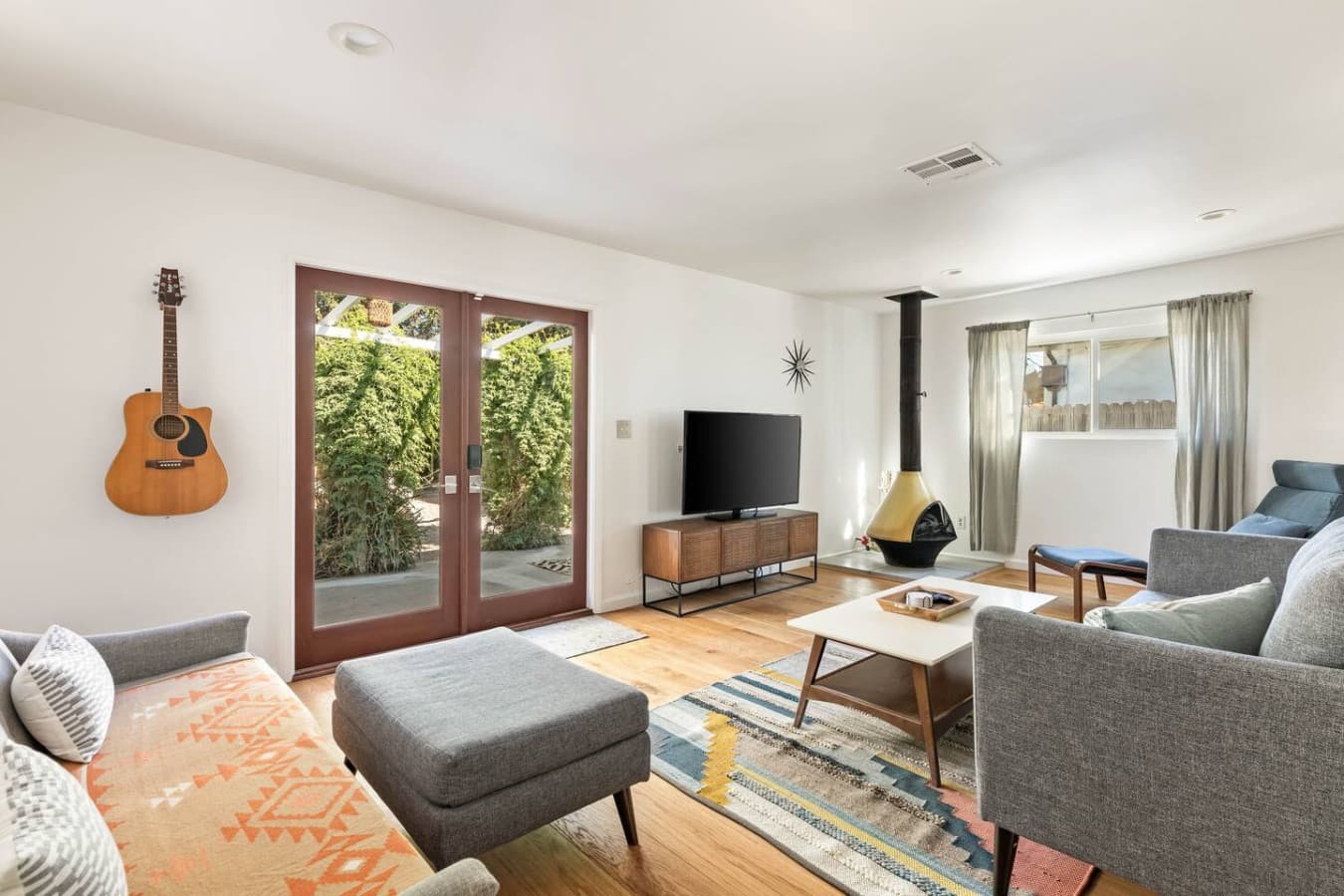 Light filled living room with garden views and comfortable seating.