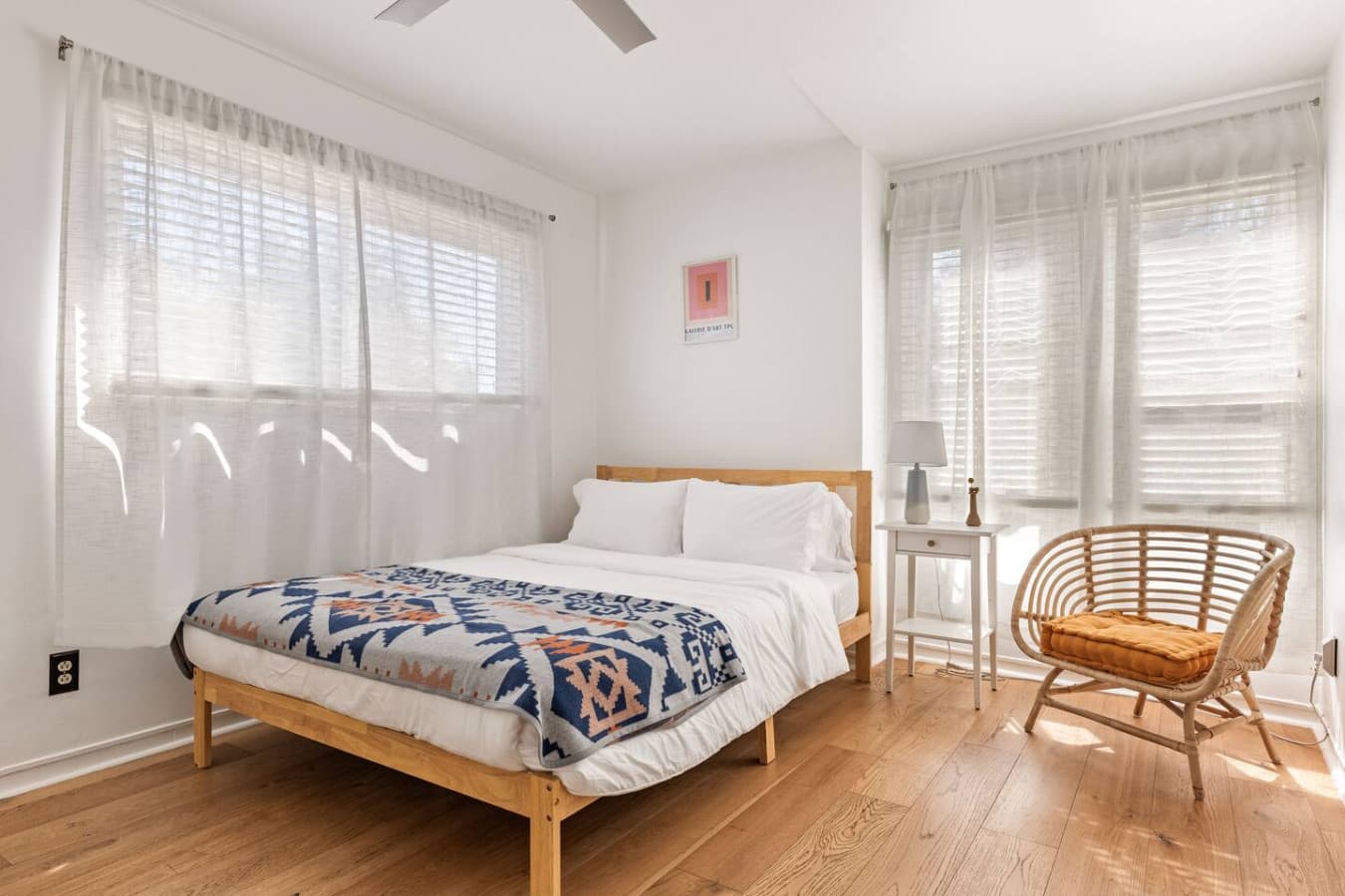 Sunny bedroom with large windows and a low profile bed for a relaxed feel.