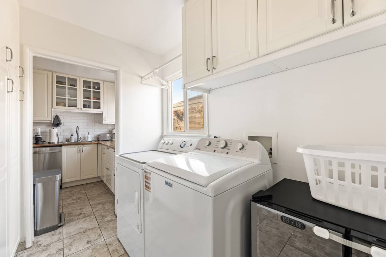Dedicated laundry area with full size washer and dryer for added convenience.