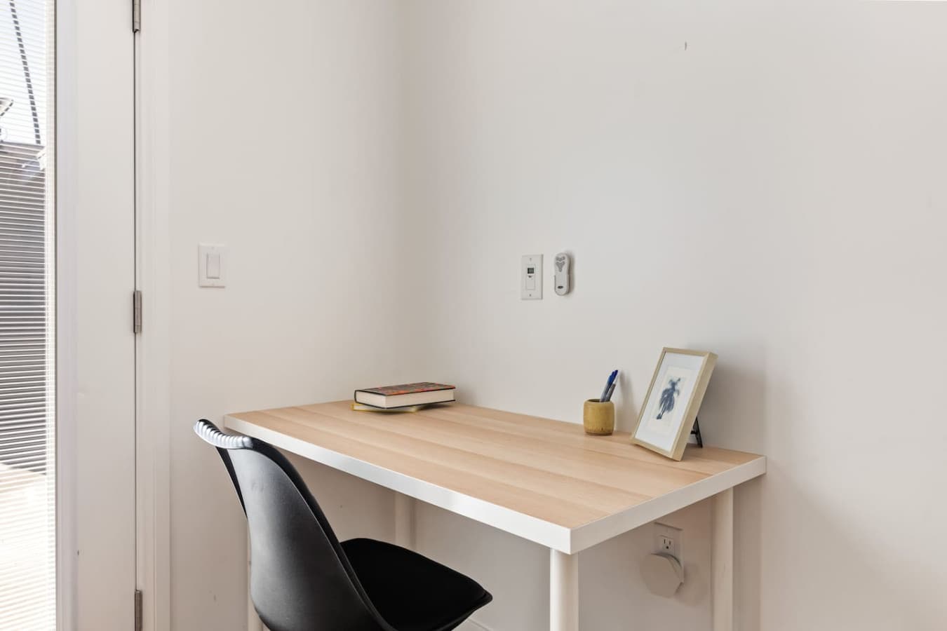 Compact workspace with natural light perfect for remote work or planning your day.