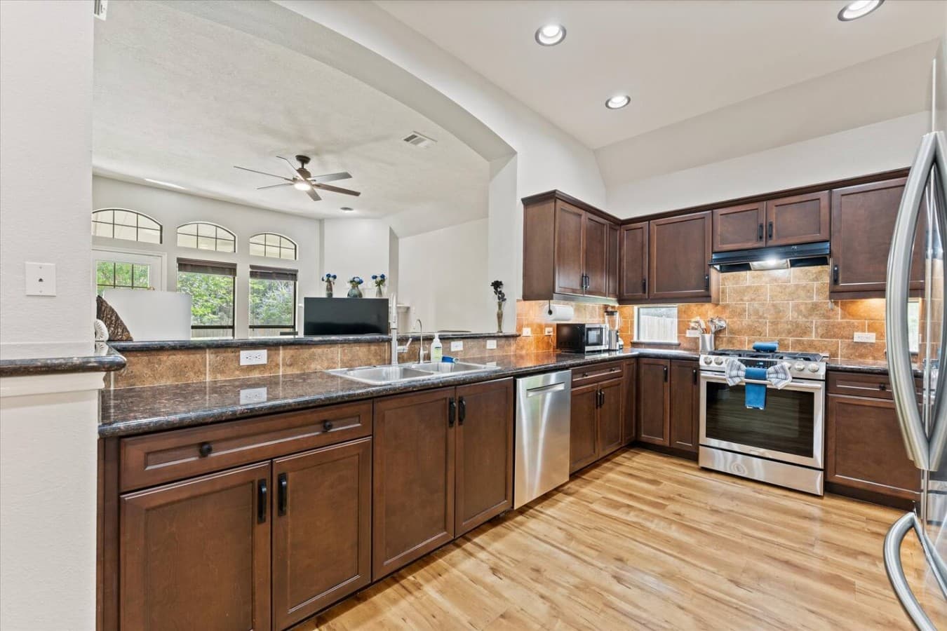Open concept kitchen with bar seating and seamless flow into the living area.