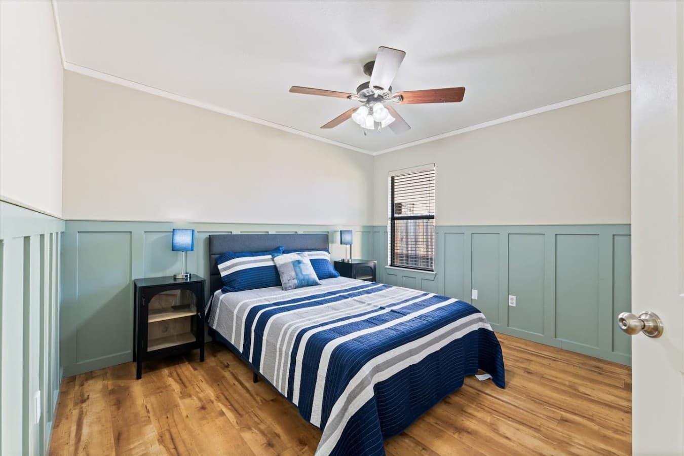 Inviting guest bedroom featuring cozy bedding and a relaxing atmosphere for a restful stay.