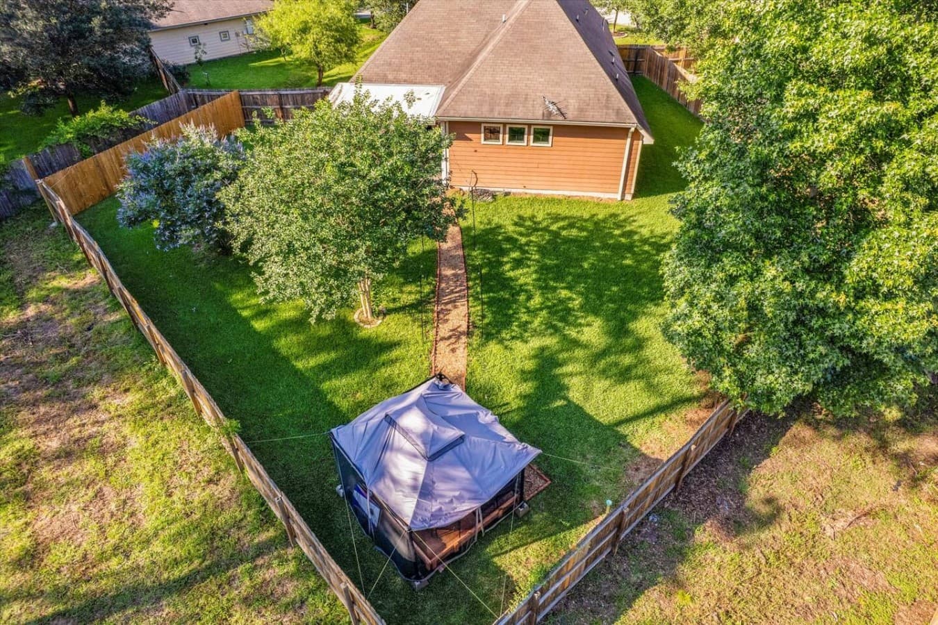 Large private backyard with plenty of open space to relax, play, and enjoy the outdoors.
