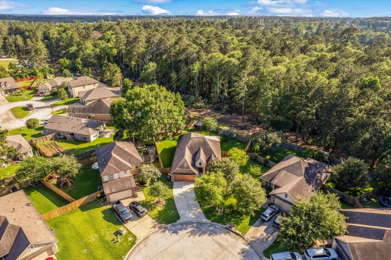 Peaceful aerial view highlighting the home’s quiet location surrounded by nature and greenery.