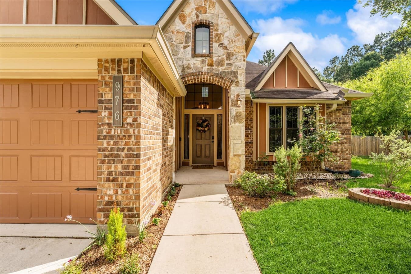 Inviting front entrance with beautiful stonework and a warm, welcoming feel from the moment you arrive.