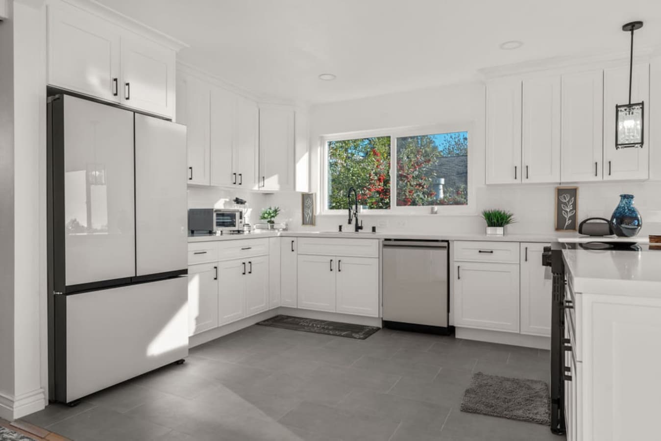 Bright and spacious kitchen with white cabinetry and plenty of counter space.