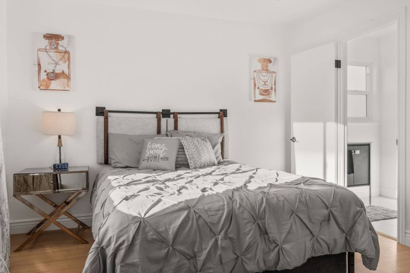 Cozy bedroom featuring a comfortable bed and soft neutral decor.