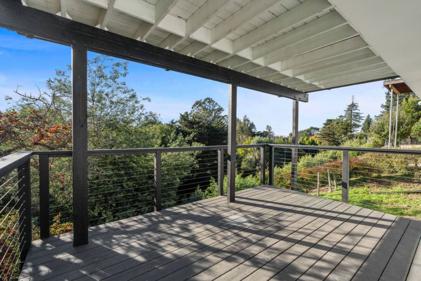 Spacious deck area with shaded coverage and plenty of room to relax outdoors.